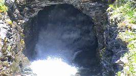A large river flows through a man-made tunnel below the railway line just beyond Upsete, 0.5 miles from the station